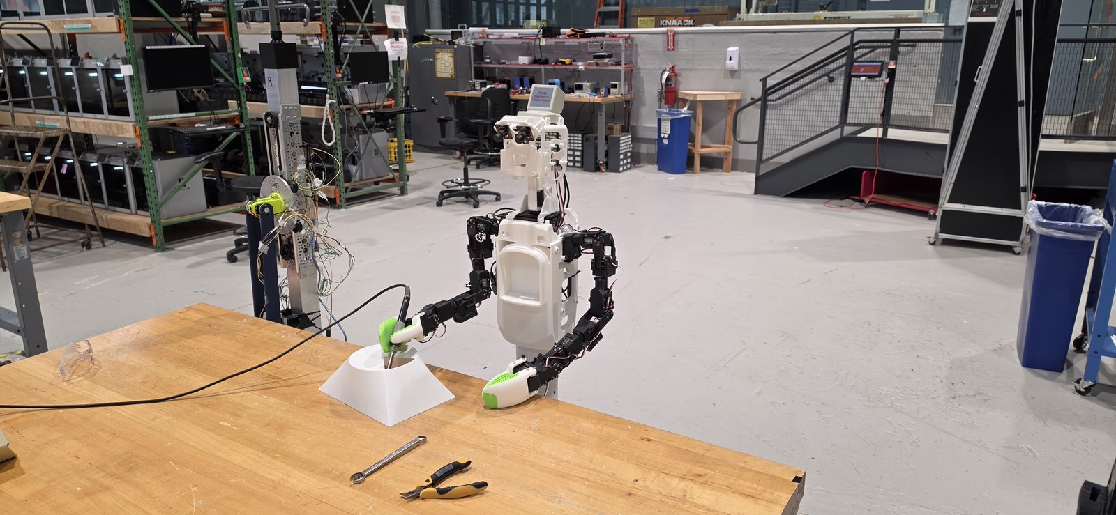 KOKO developer prototype working at a robotics lab bench.